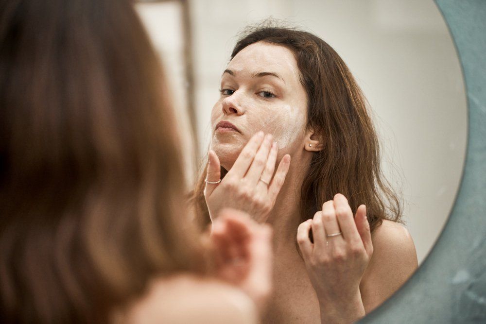 Applying Skin Care — Great Neck, NY — Butterfly Garden Spa