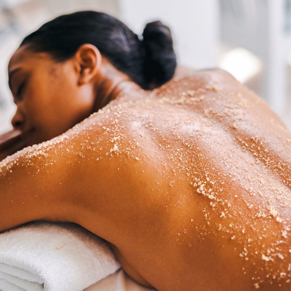 Woman Getting An Exfoliating Massage — Great Neck, NY — Butterfly Garden Spa