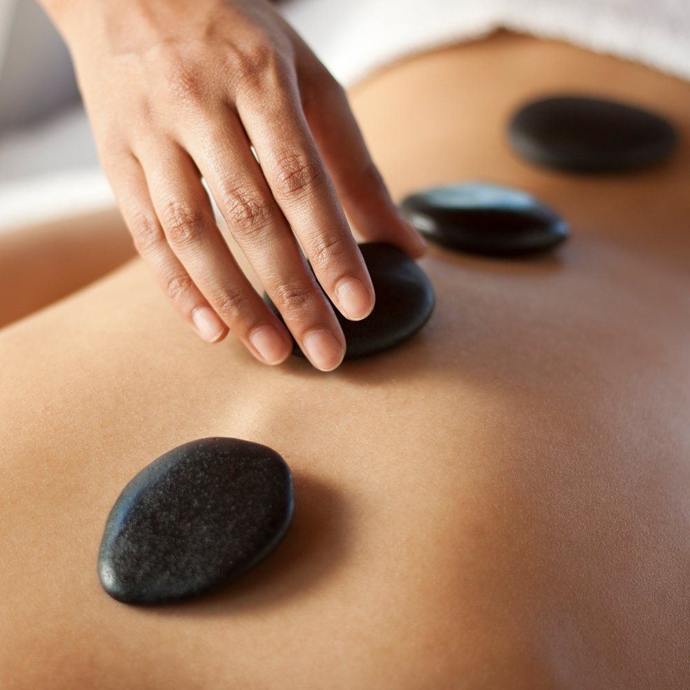 Using Stone For Massage — Great Neck, NY — Butterfly Garden Spa Using Stone For Massage — Great Neck, NY — Butterfly Garden Spa