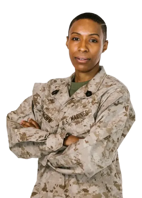 A woman in a military uniform with her arms crossed