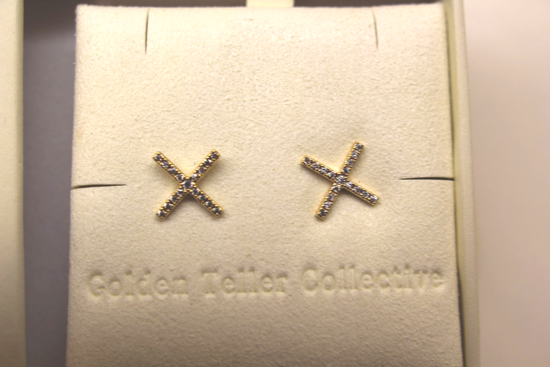X stud earrings