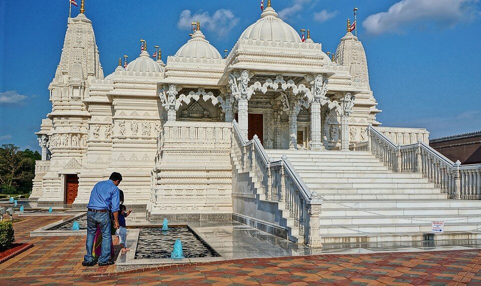 BAPS Swaminarayan Mandir Bartlett Illinois showing the white marble Hindu temple that reflects the community's cultural diversity
