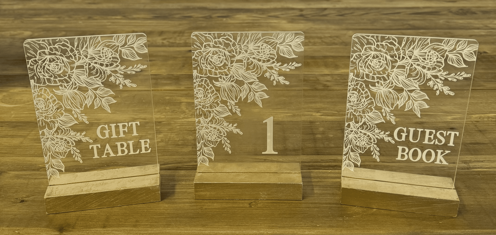 Three acrylic table signs with floral border:
