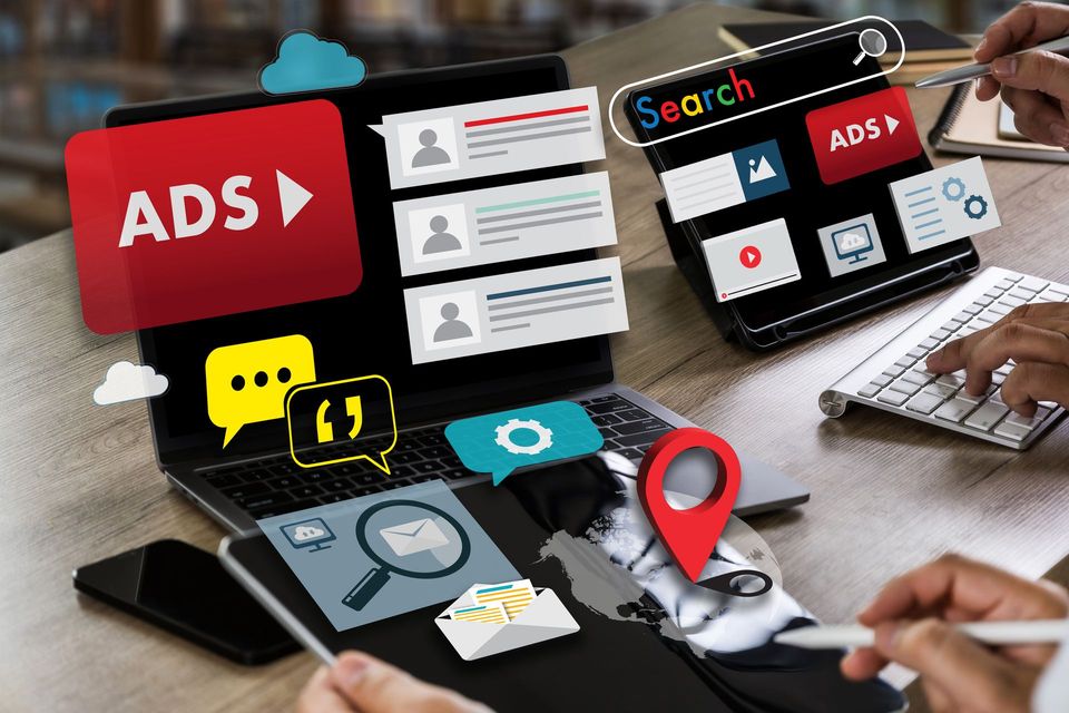 closeup of person using tablet with icons floating