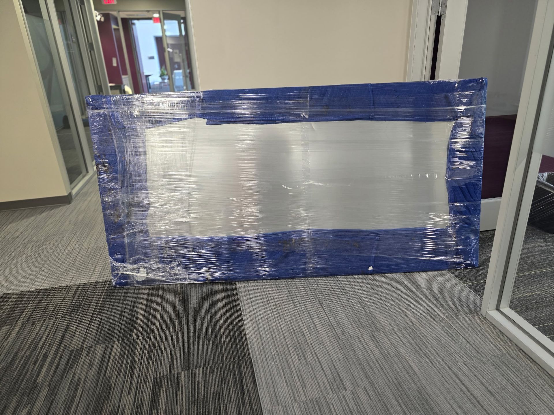 Large office white board expertly wrapped and ready for transport in Cary, NC.