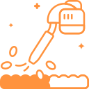 Orange illustration of a leaf blower blowing debris from a surface.