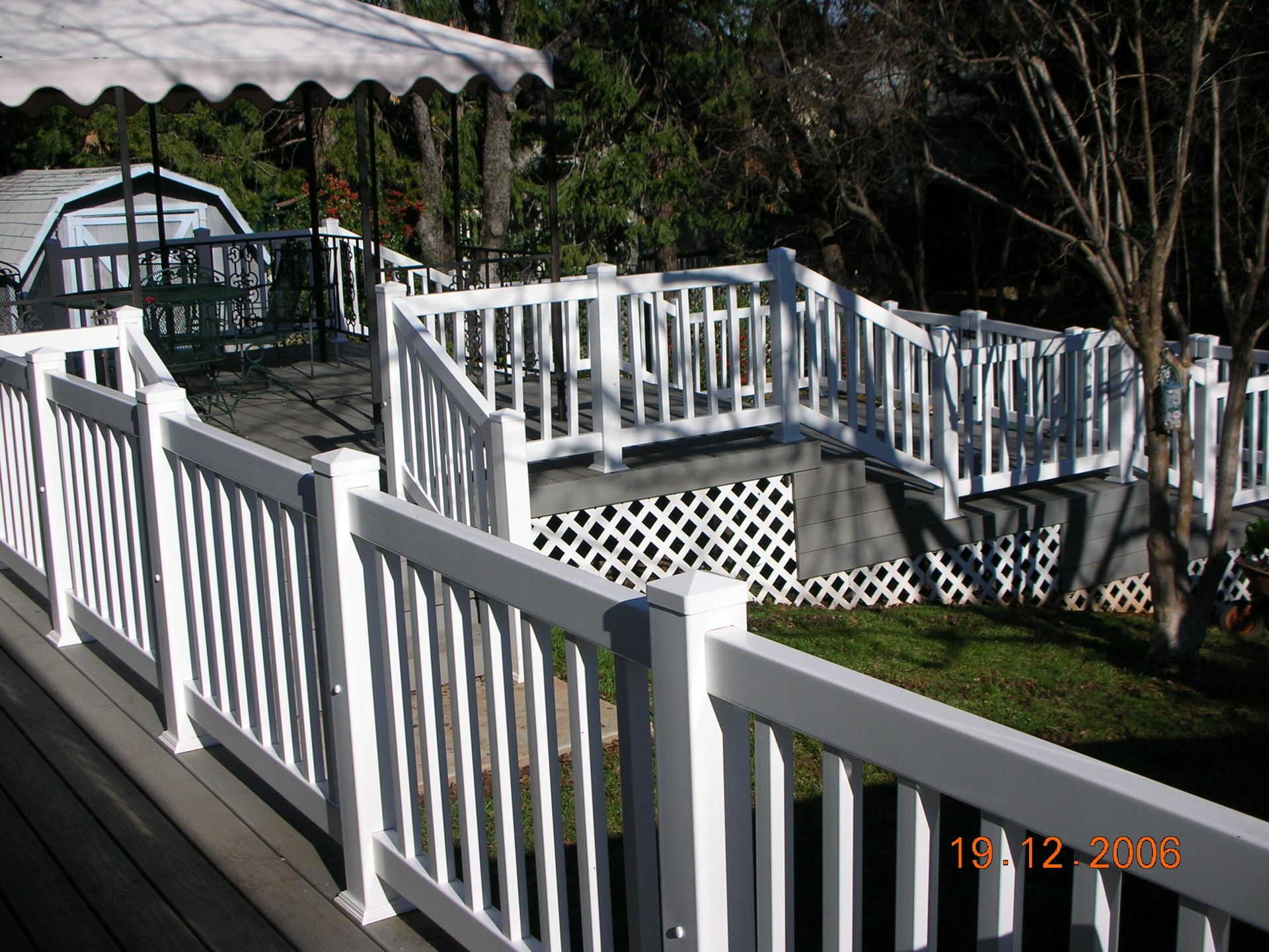 A picture of a white fence taken in 2006
