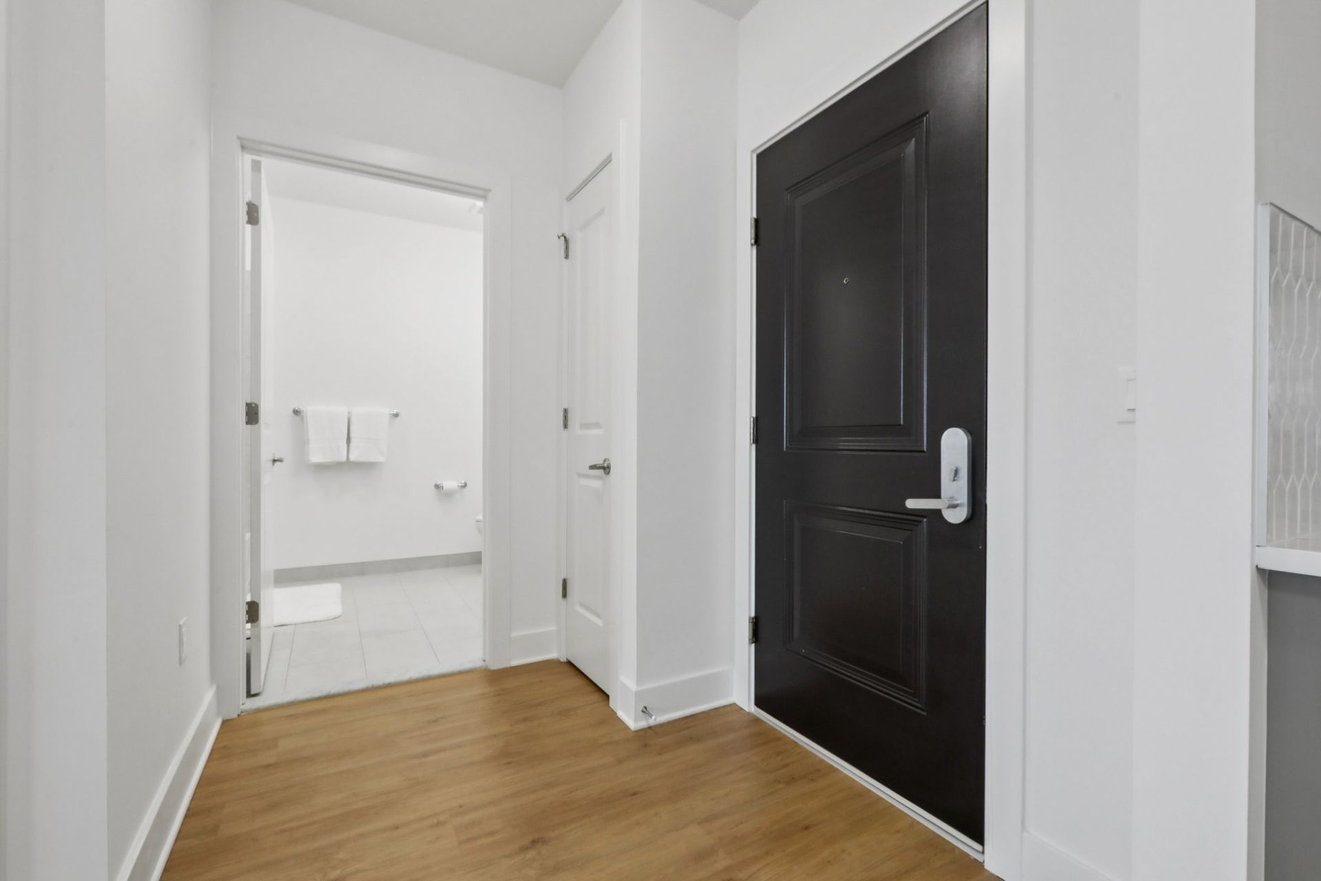 Apartment hallway with entryway door at Meridia Little Ferry apartments, Little Ferry NJ