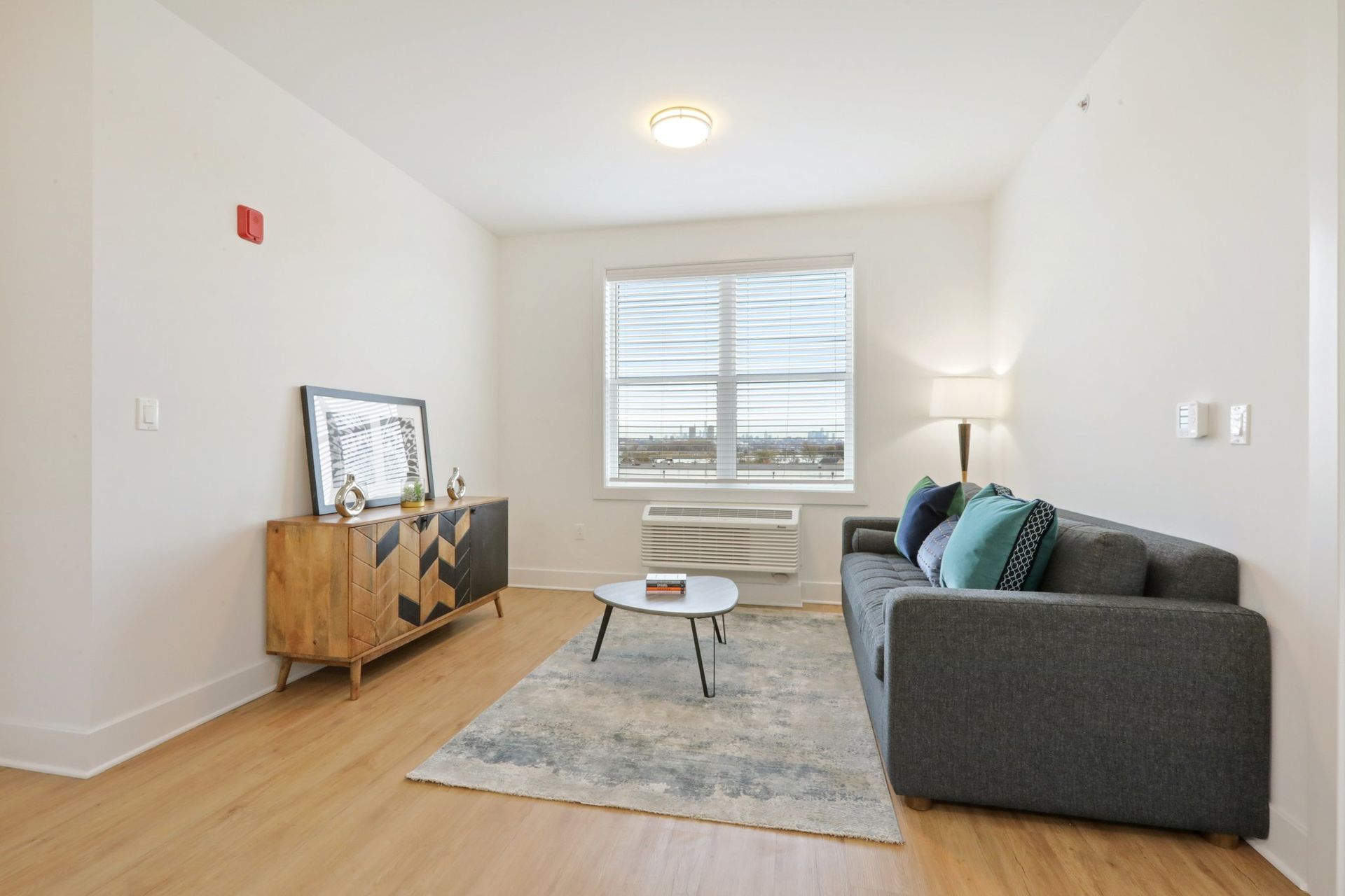 Modern living room with large windows at Meridia Little Ferry luxury apartments NJ