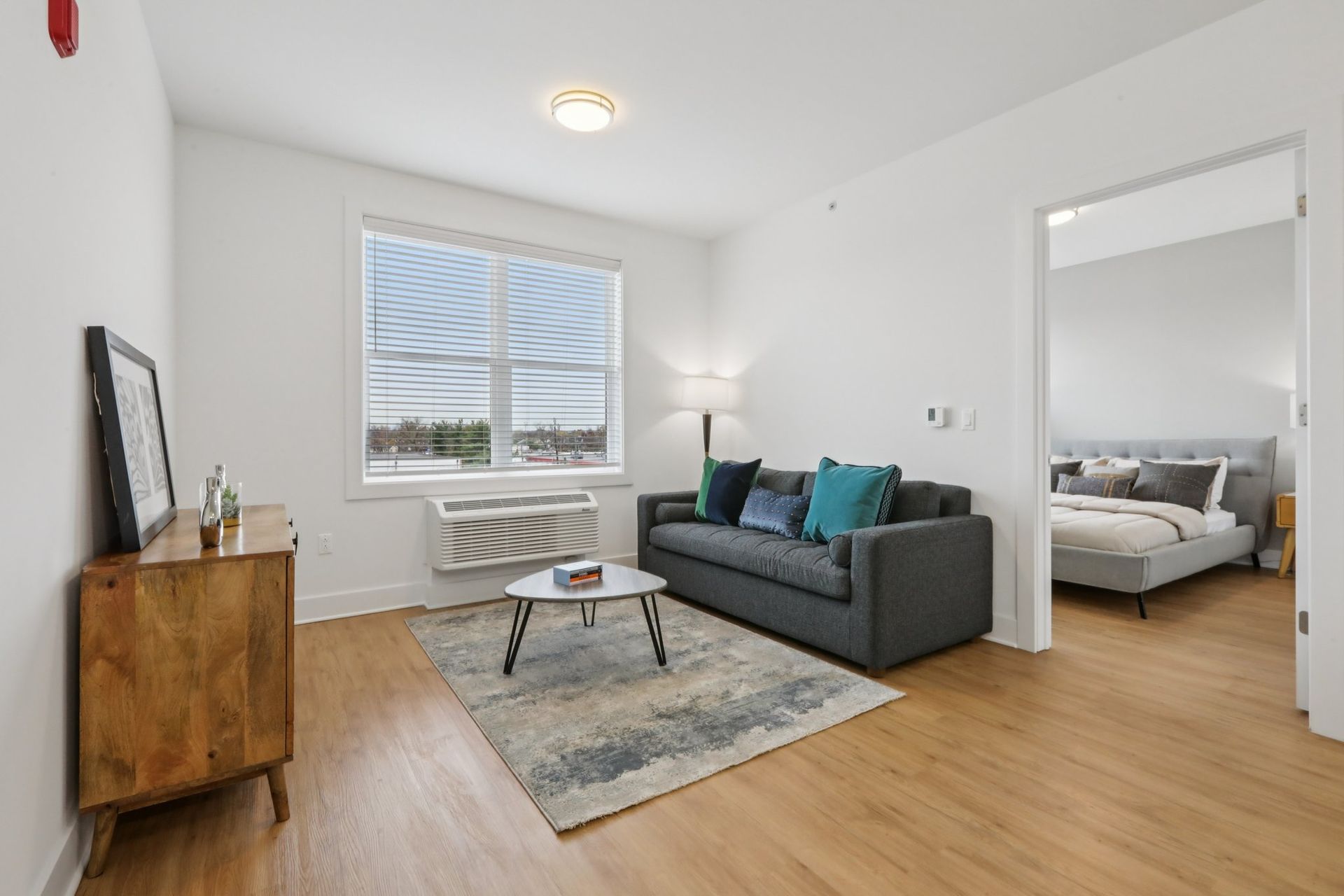 Bright living room and bedroom suite at Meridia Little Ferry luxury apartments NJ