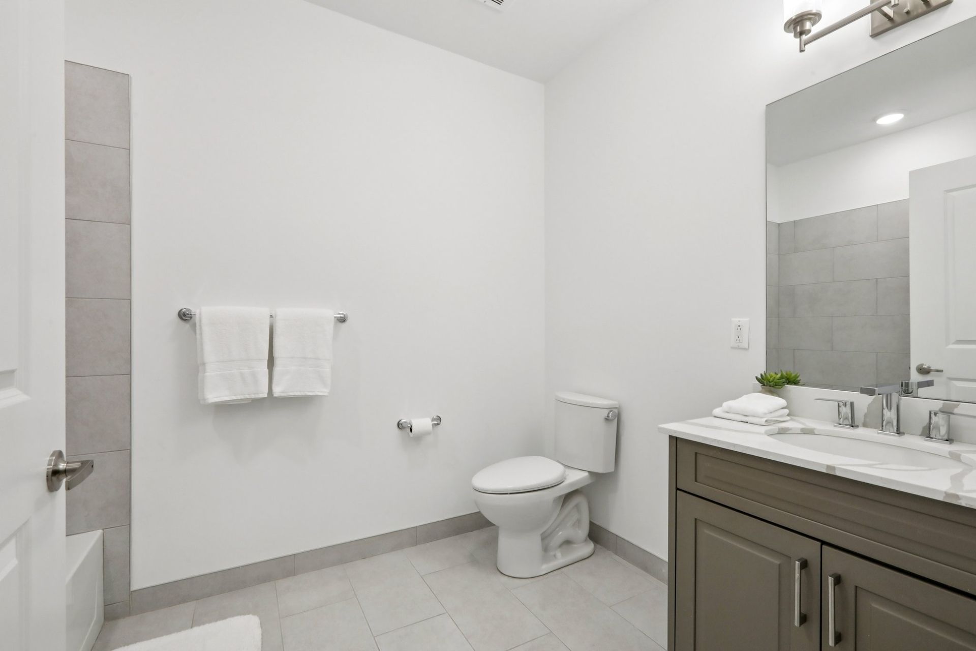 Open-concept kitchen and living room with island at Meridia Little Ferry, Little Ferry NJ