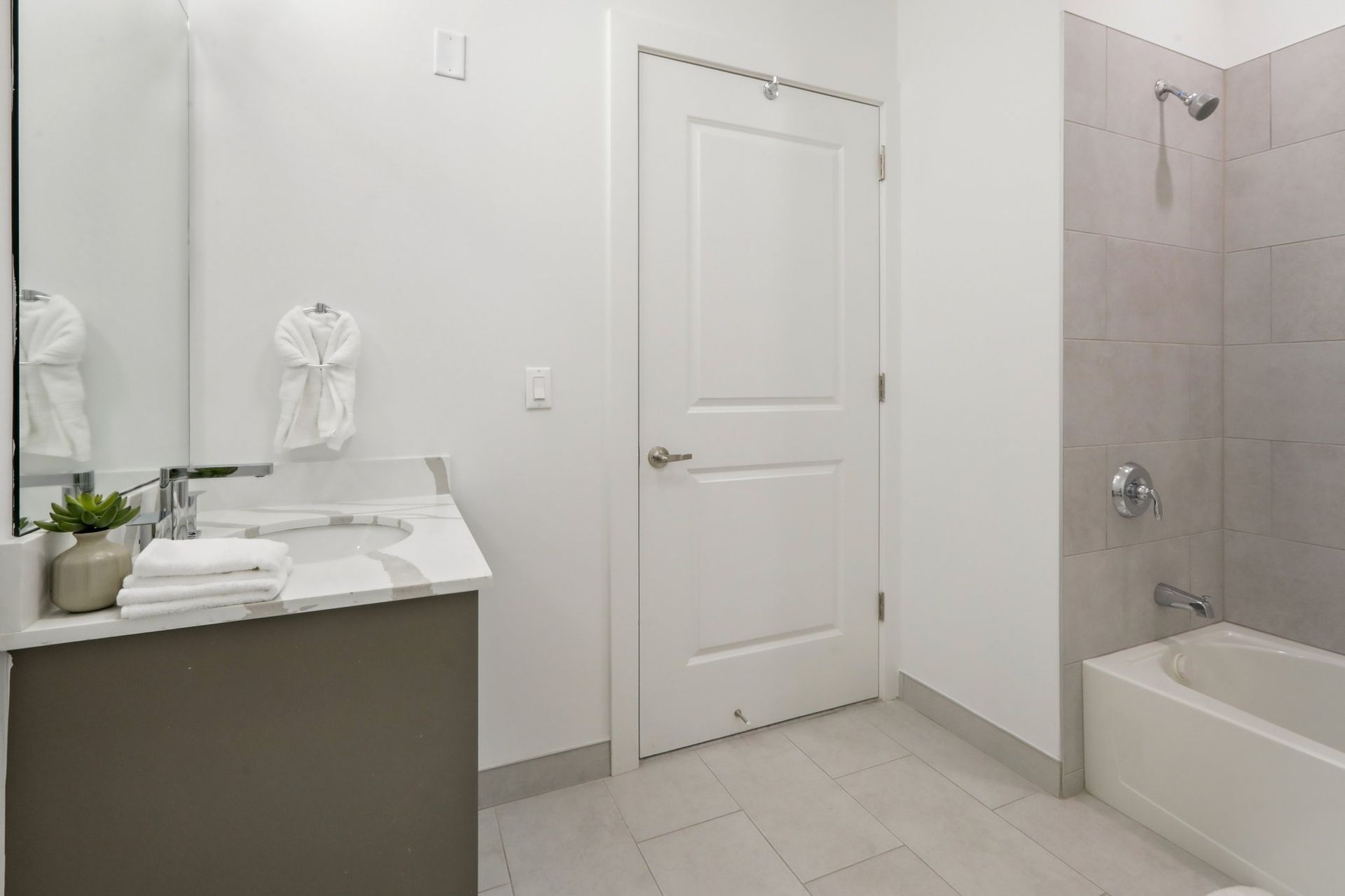 Clean bathroom with soaking tub and walk-in shower at Meridia Little Ferry luxury apartments, Little Ferry NJ