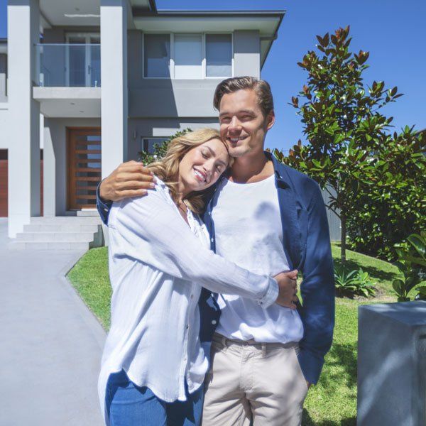 Couple Standing in Front of Their New Home — Geelong West, Vic — Geelong Finance Company