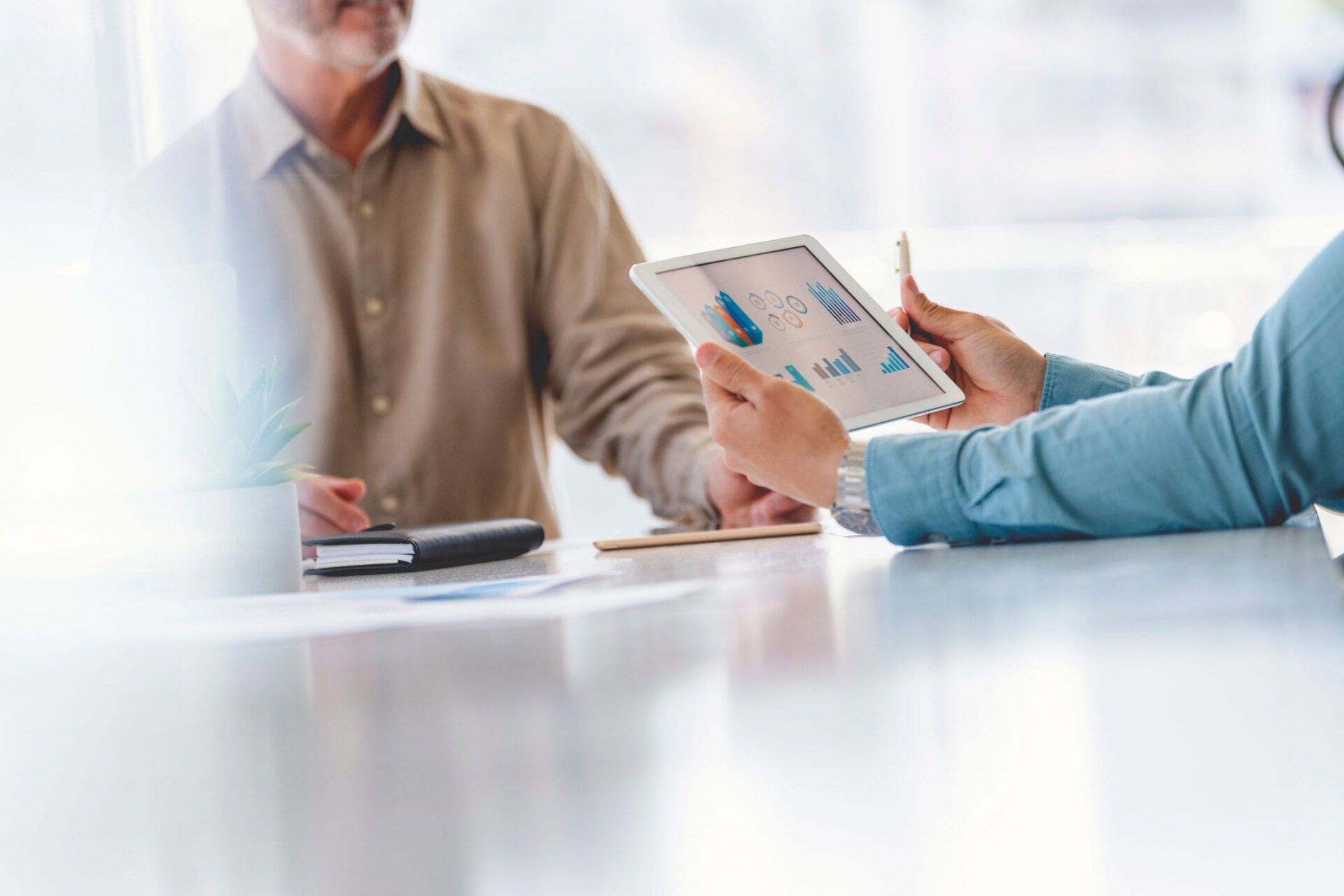 Close Up Business People Working On Financial Data on a Digital Tablet — Newtown, Vic — Geelong Finance Company