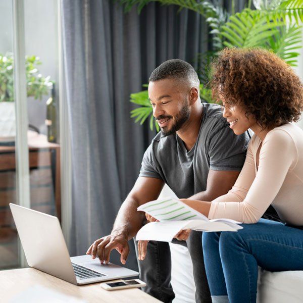 Loving African American Couple Paying Bills Online at Home — Geelong West, Vic — Geelong Finance Company