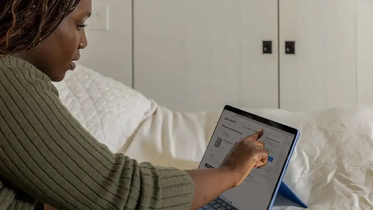 Woman using laptop.