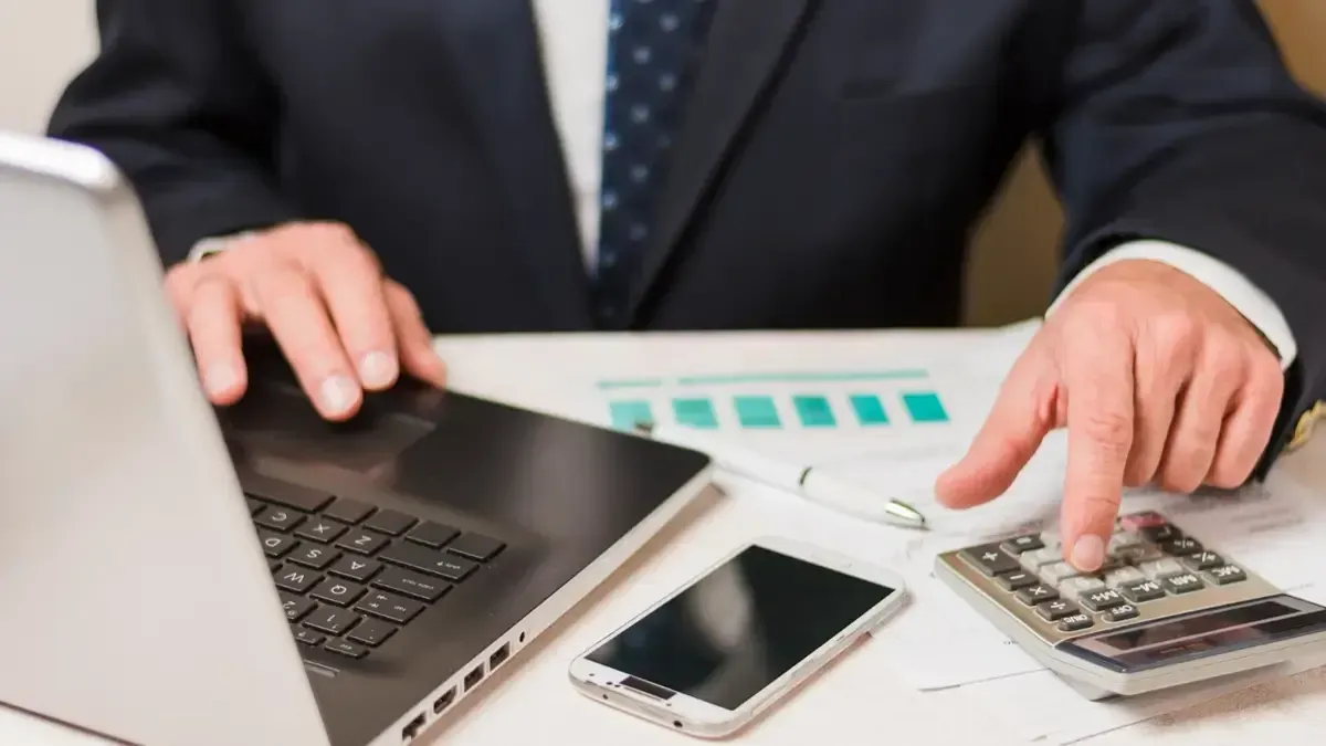 A businessman calculating tax savings