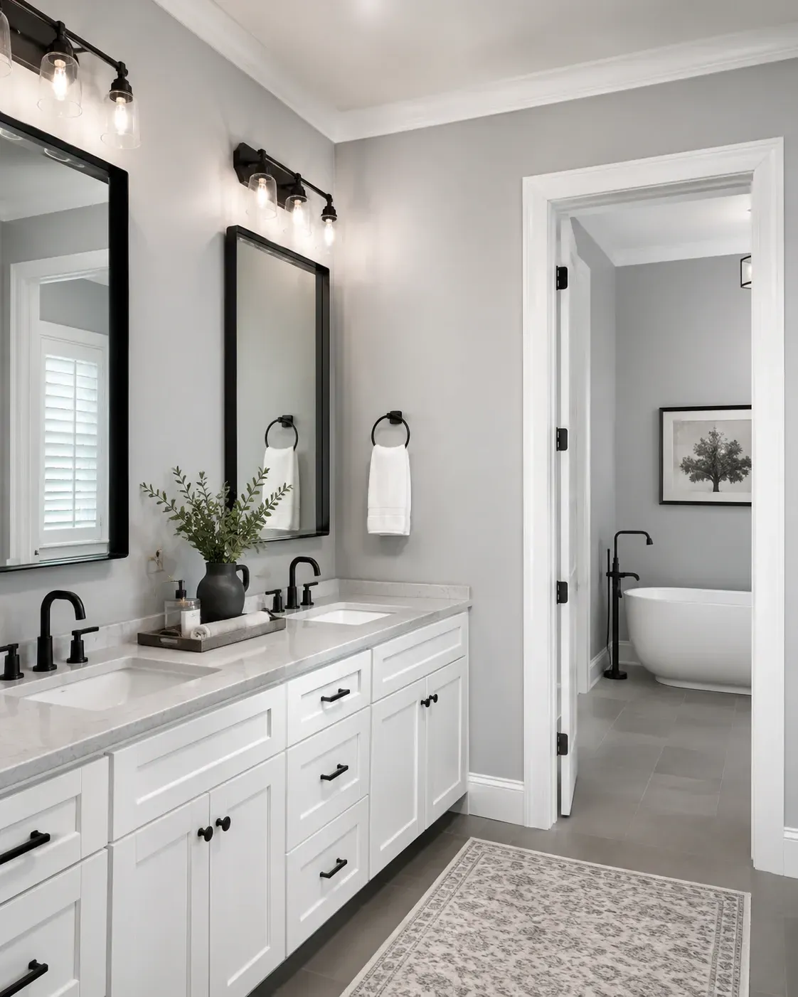 Residential bathroom painting in Rockford IL with fresh gray walls, white trim, double vanity, and updated finish
