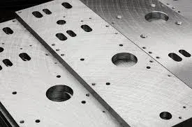 Metal plates with various holes and slots.