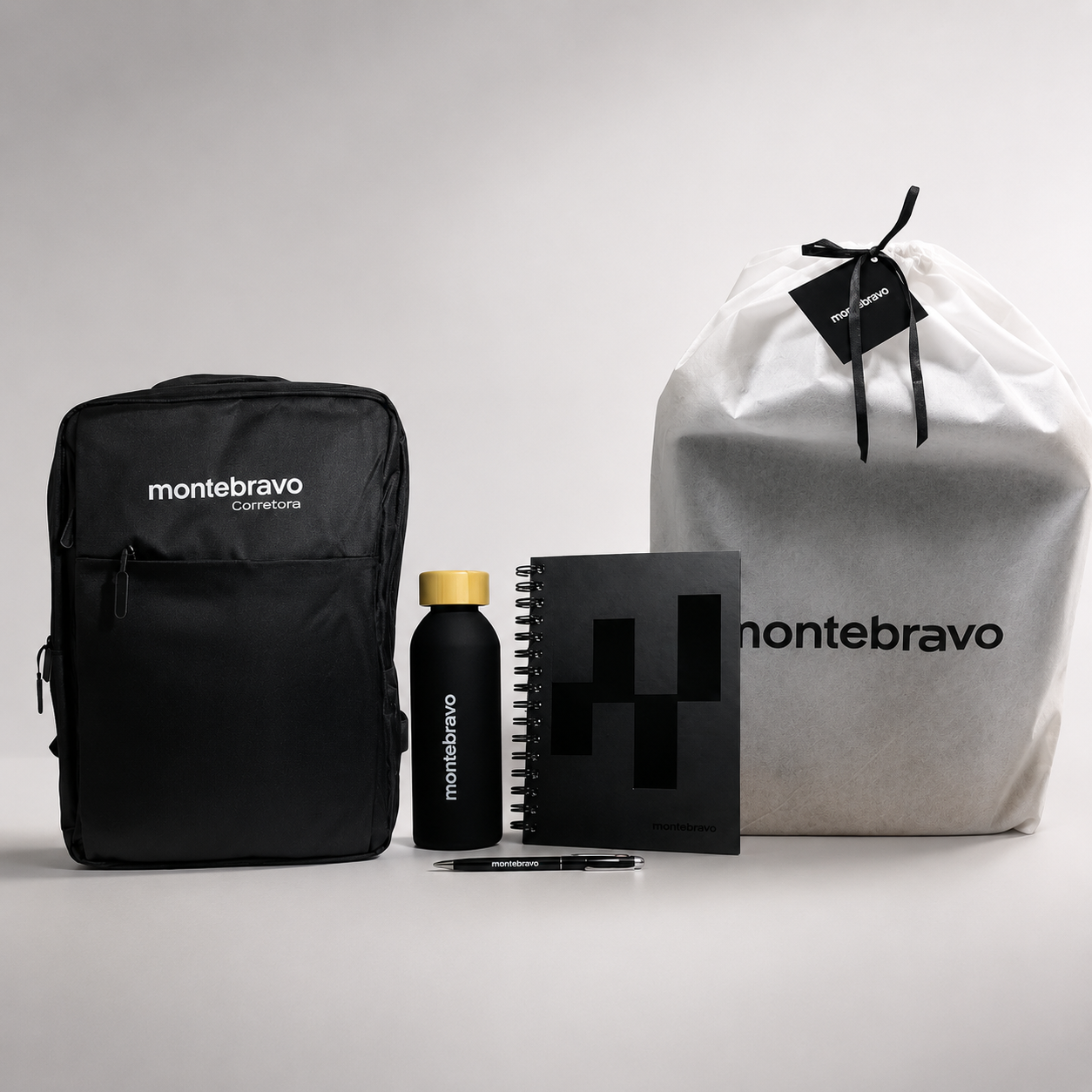 Black and white Montebravo product kit with pouch, bottle, box, and drawstring bag on a light background
