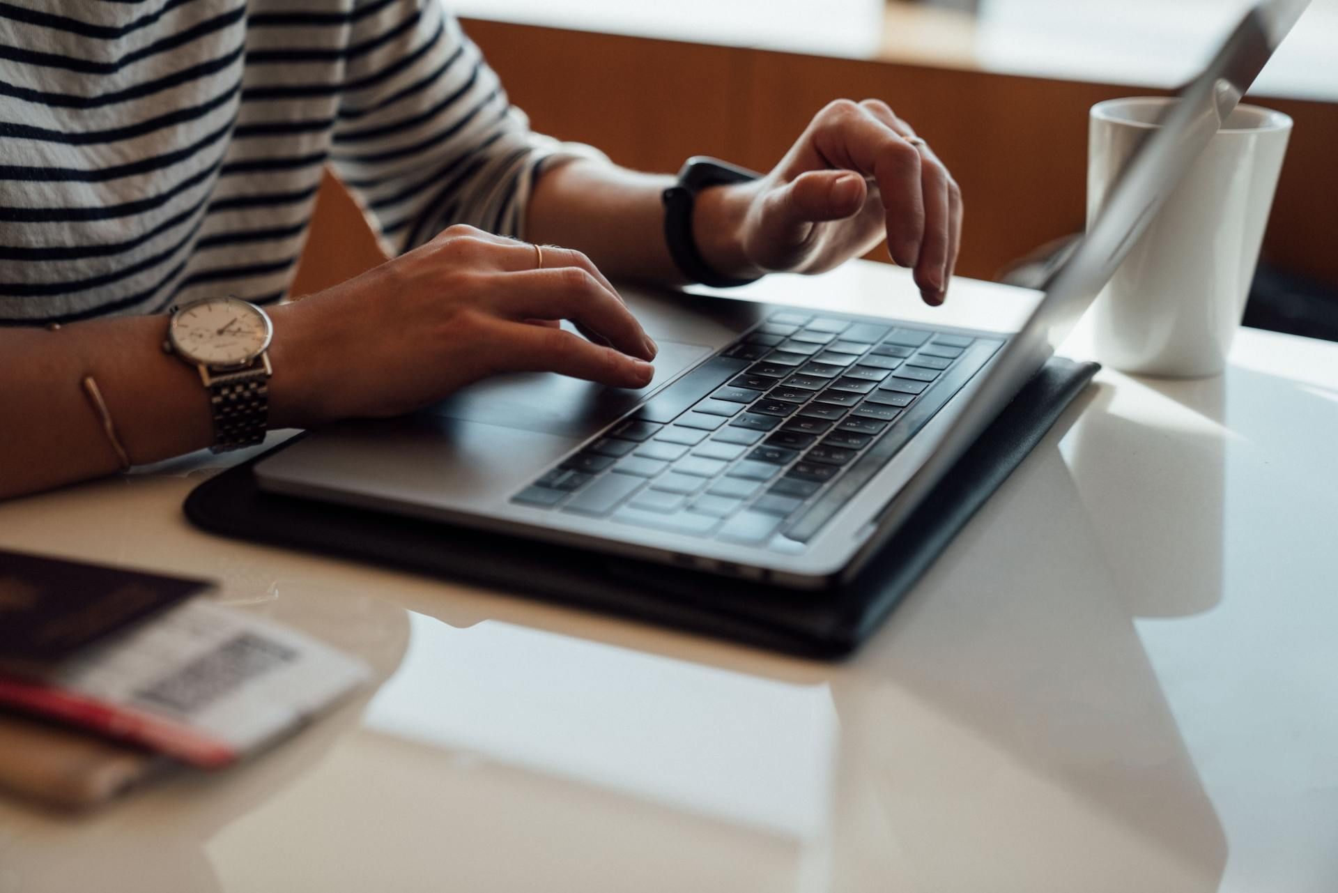 Typing on a laptop