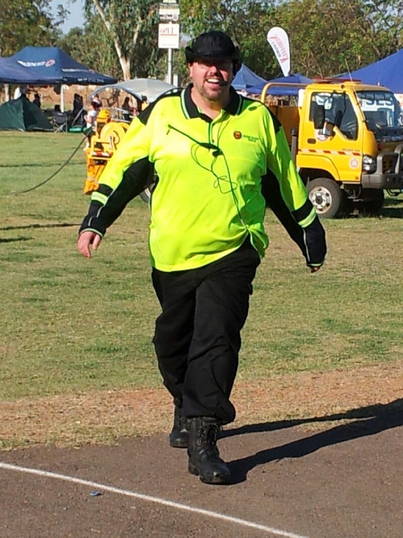 Man in neon green and black work clothes