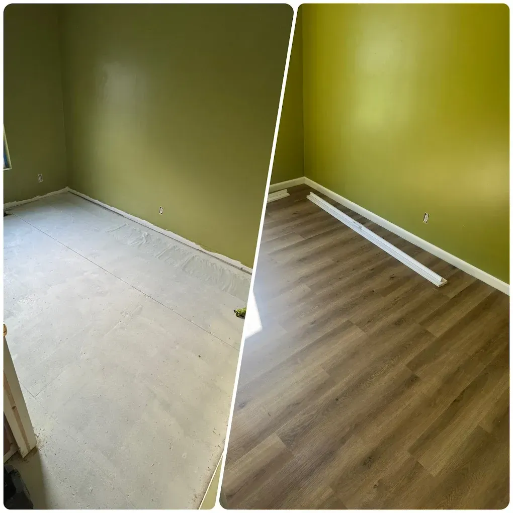 Empty room with olive-green walls and two flooring stages: bare subfloor and installed wood-look planks.