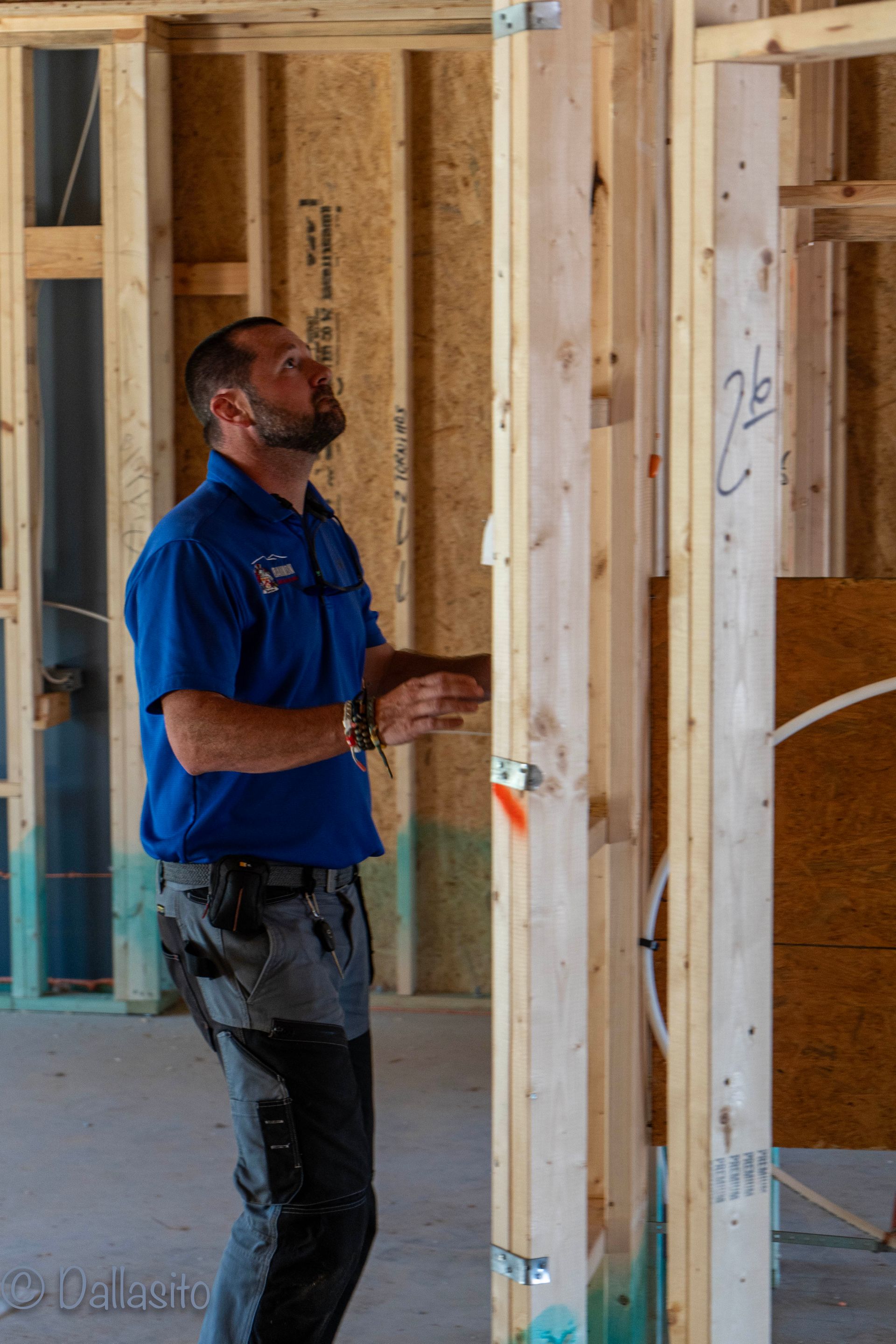home inspector at a pre-drywall inspection