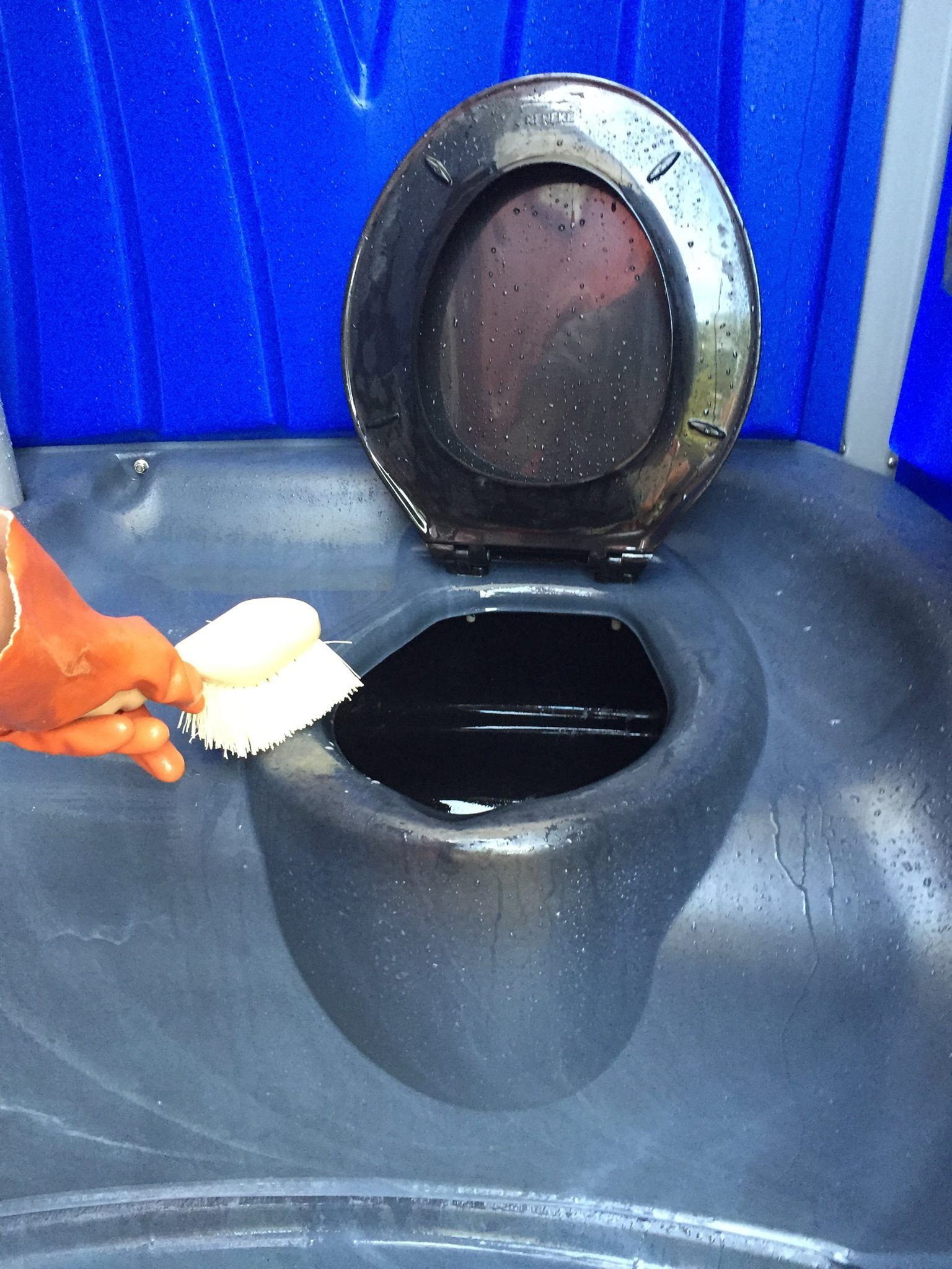 Cleaning Portable Toilet — Belchertown, MA — Parker’s Portables LLC