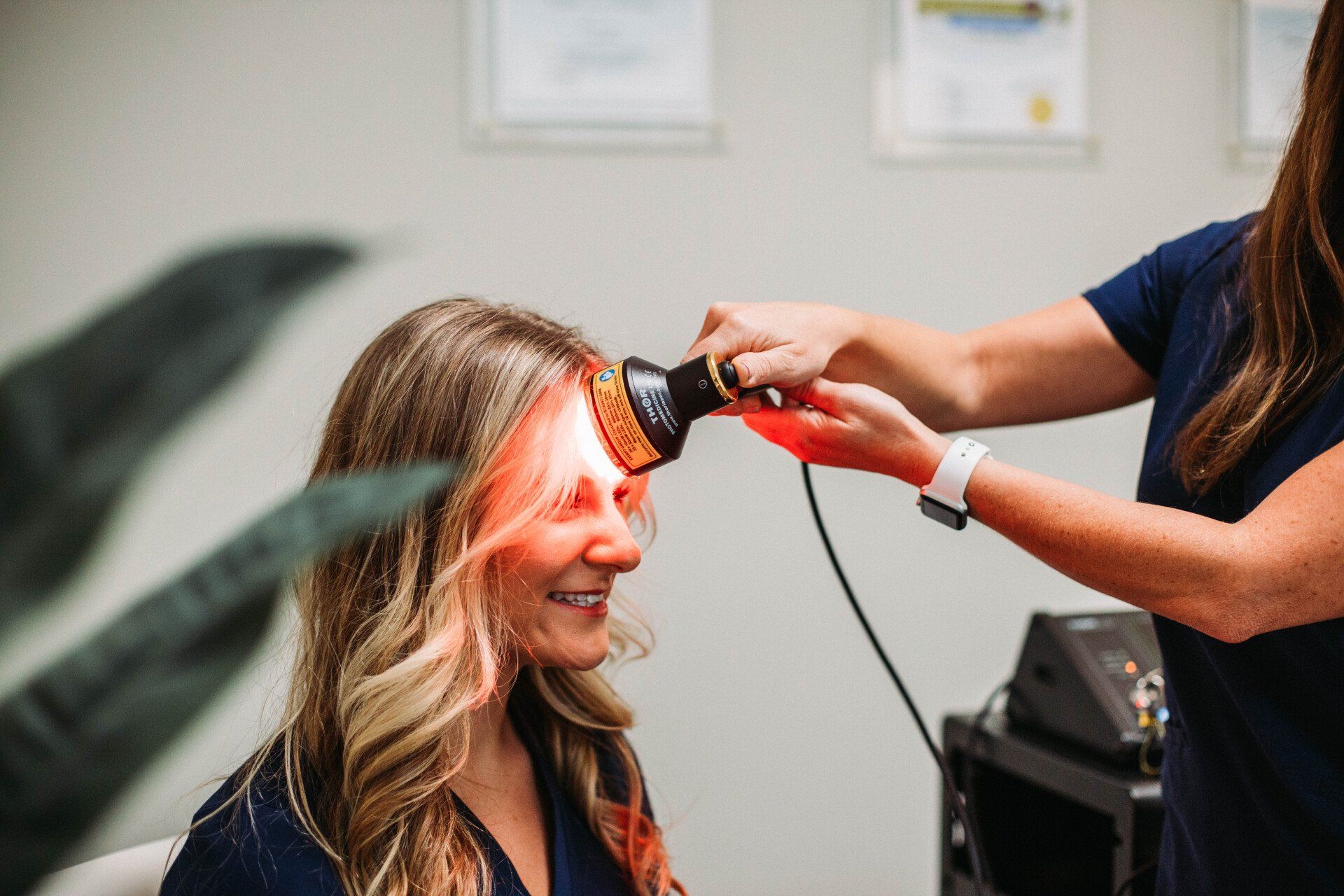 Woman getting a haircut with electric clippers in a salon