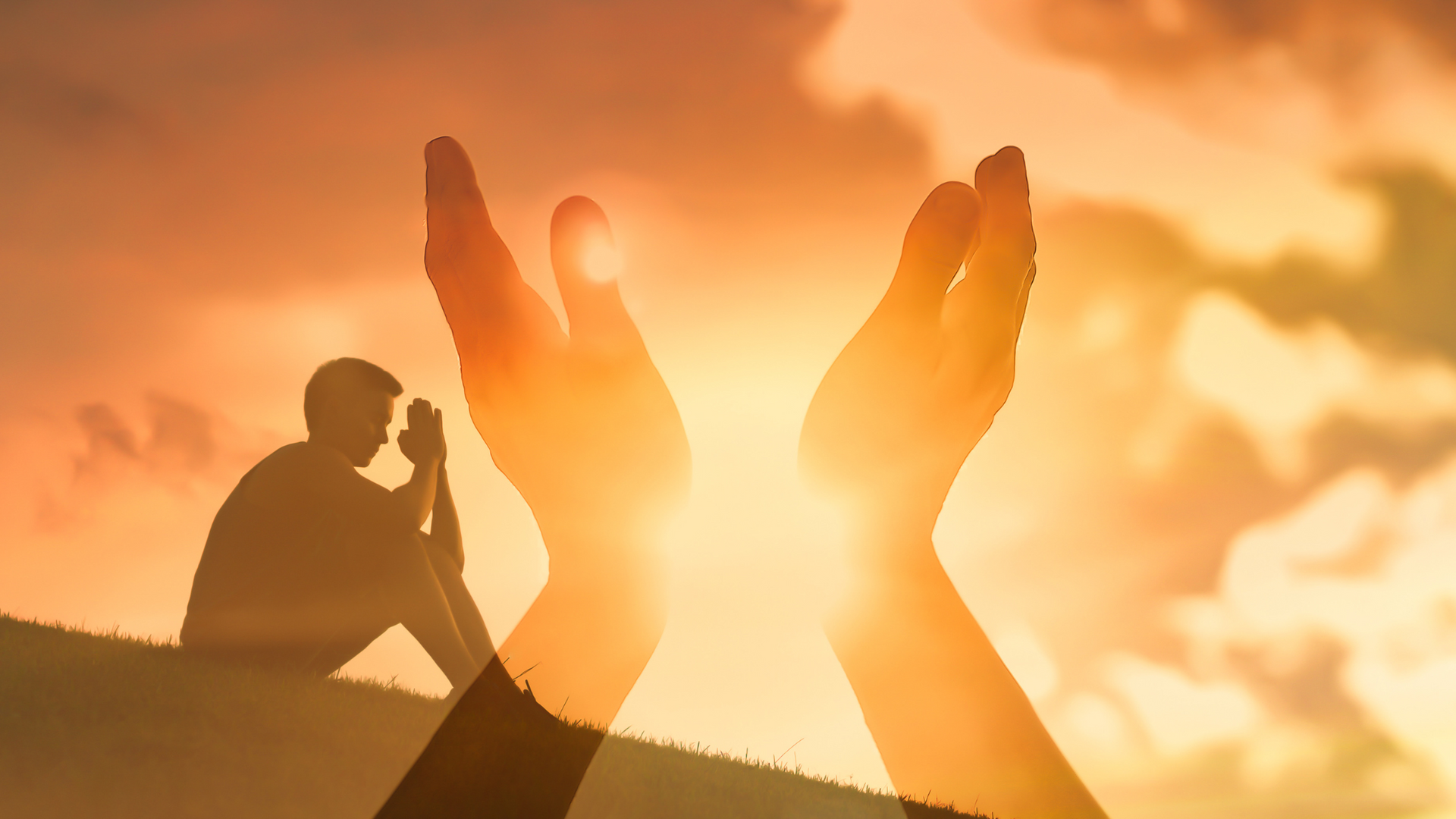 Hands raised towards the sun, with a silhouetted person praying in the background. Sunset colors.