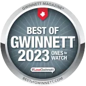 Circular “Best of Gwinnett 2023” badge with gray and red design and “Ones to Watch” text