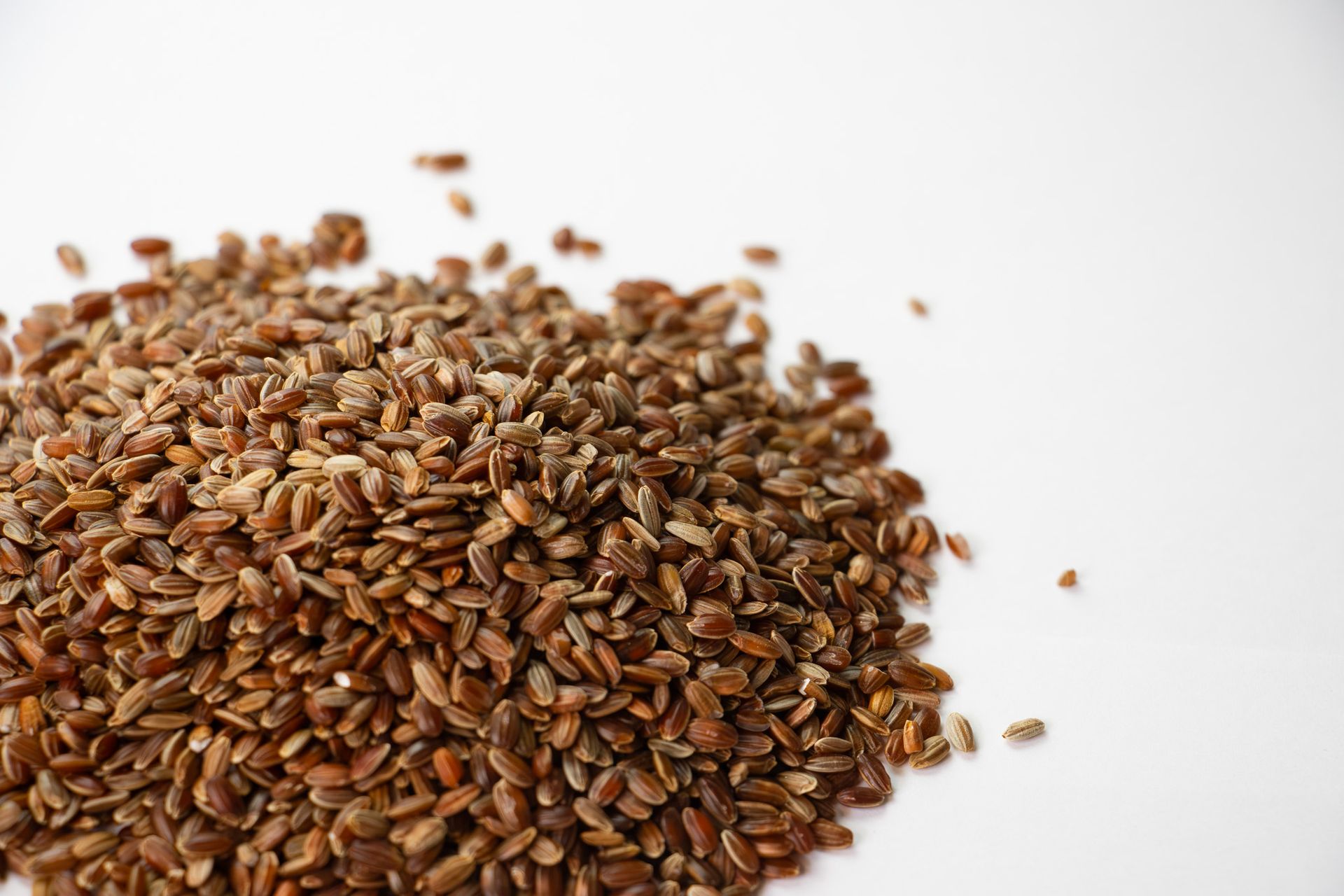 Package of Red Rice in a clear plastic bag with a brown label and visible grains