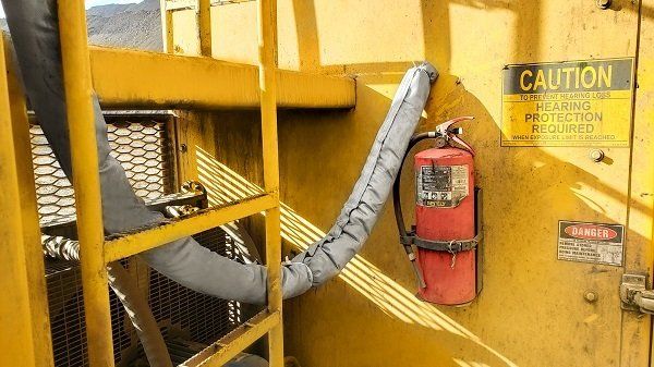 An industrial vehicle struggles with the problem of DEF freezing while being parked in the snow