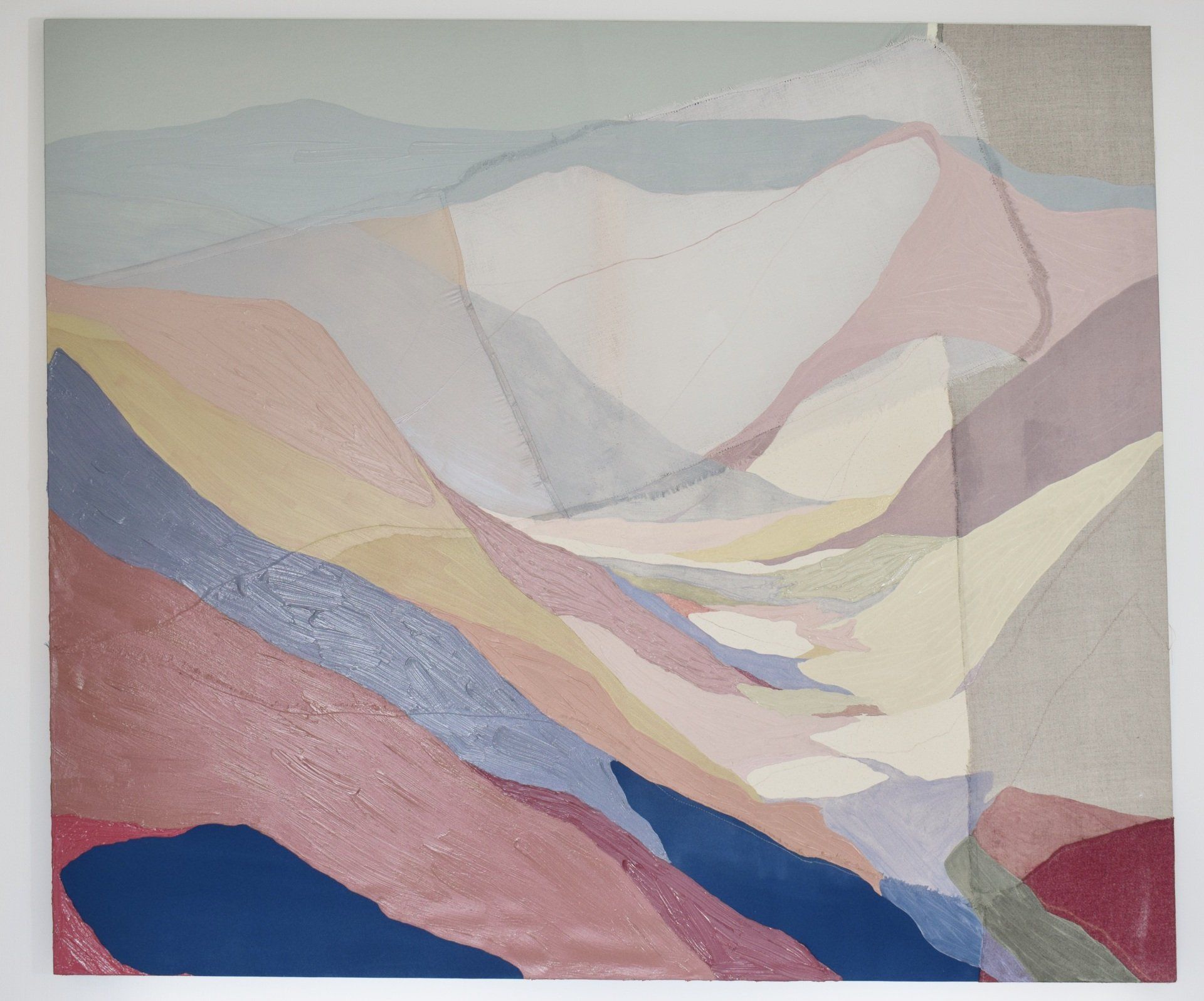 Photo of abstract painting of hills and landscape with  red, orange blue and purple tones