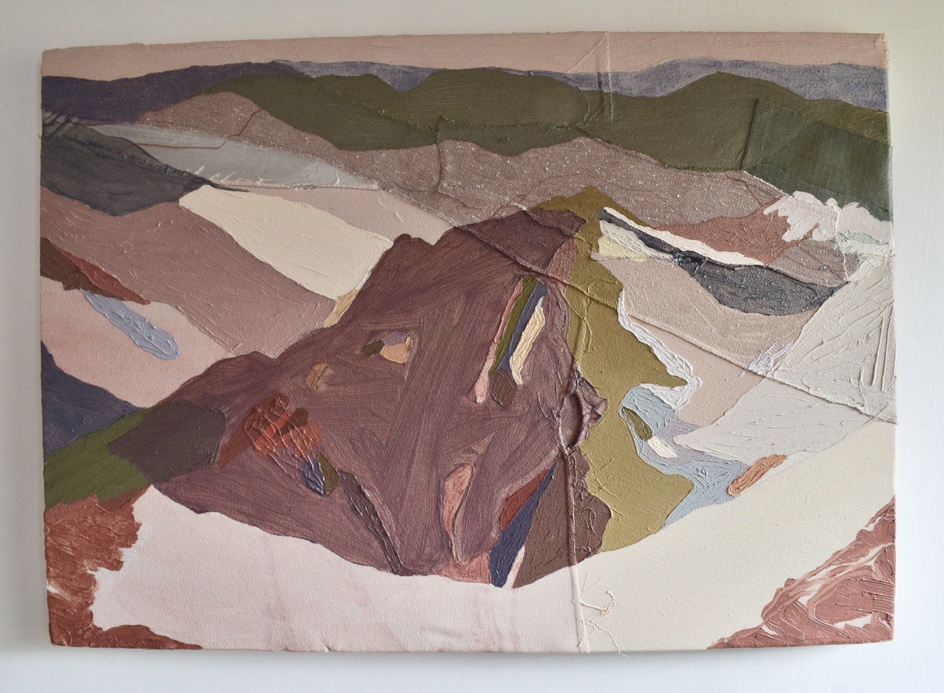 Photo of abstract painting hanging on white wall