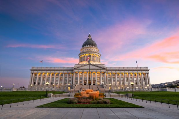 Utah State Capitol Building at sunset with pink and blue sky.