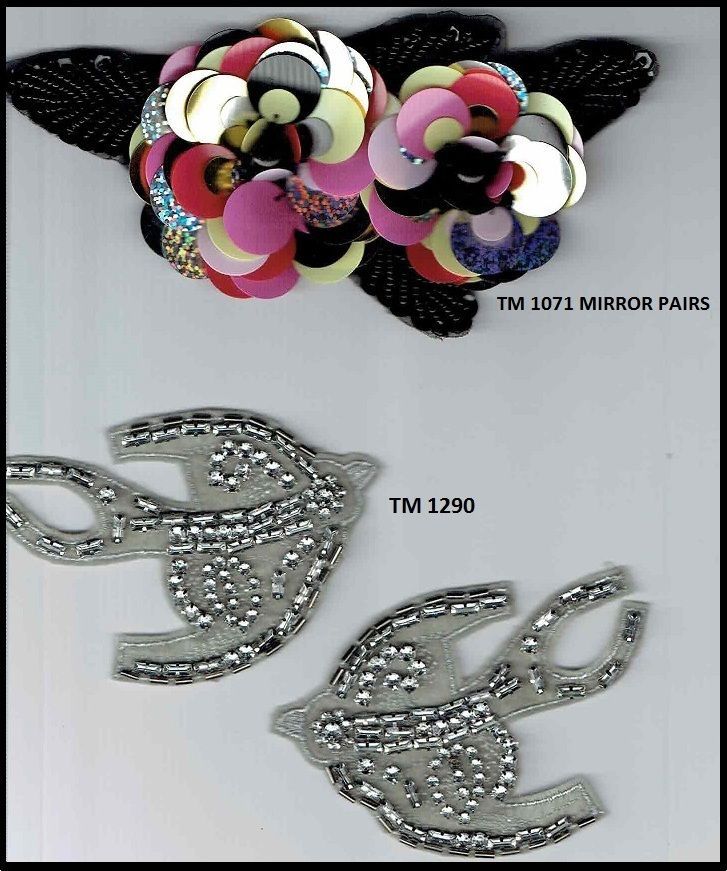 A pair of tm 1290 mirror pairs with sequins and rhinestones