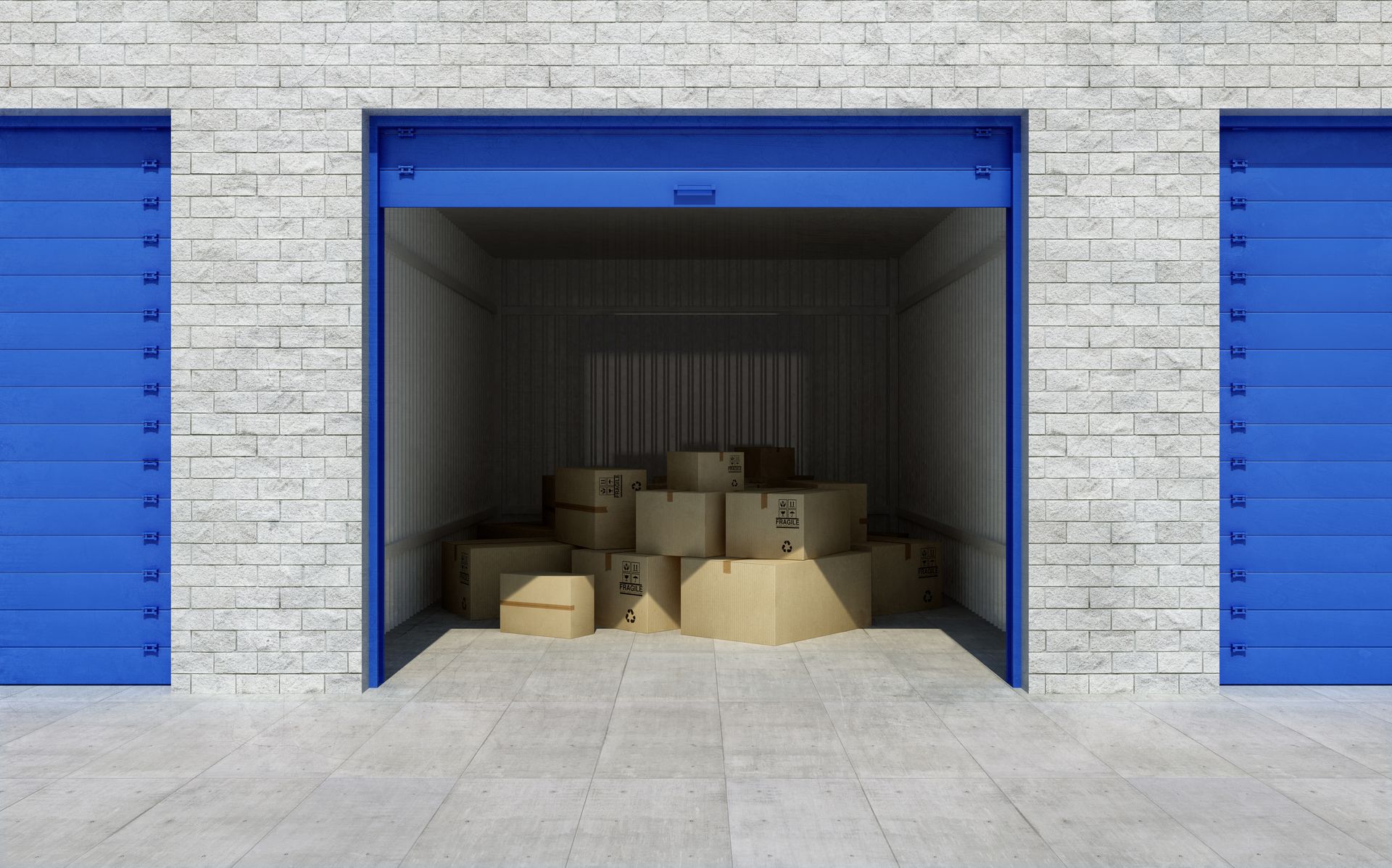 Open self-storage unit with stacked cardboard boxes inside. Open self-storage unit with stacked cardboard boxes inside.