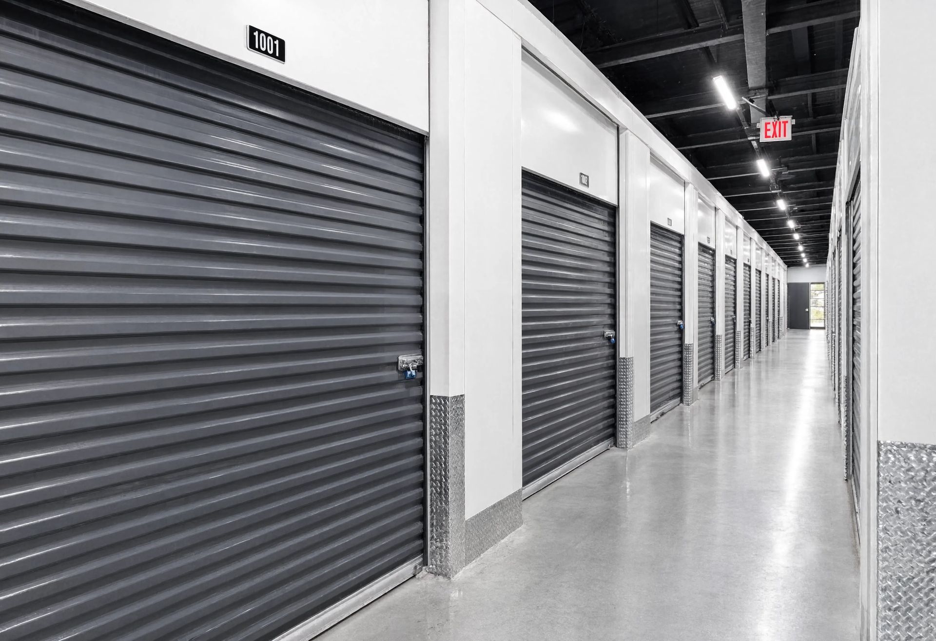 Secure self storage units with locked roll-up doors