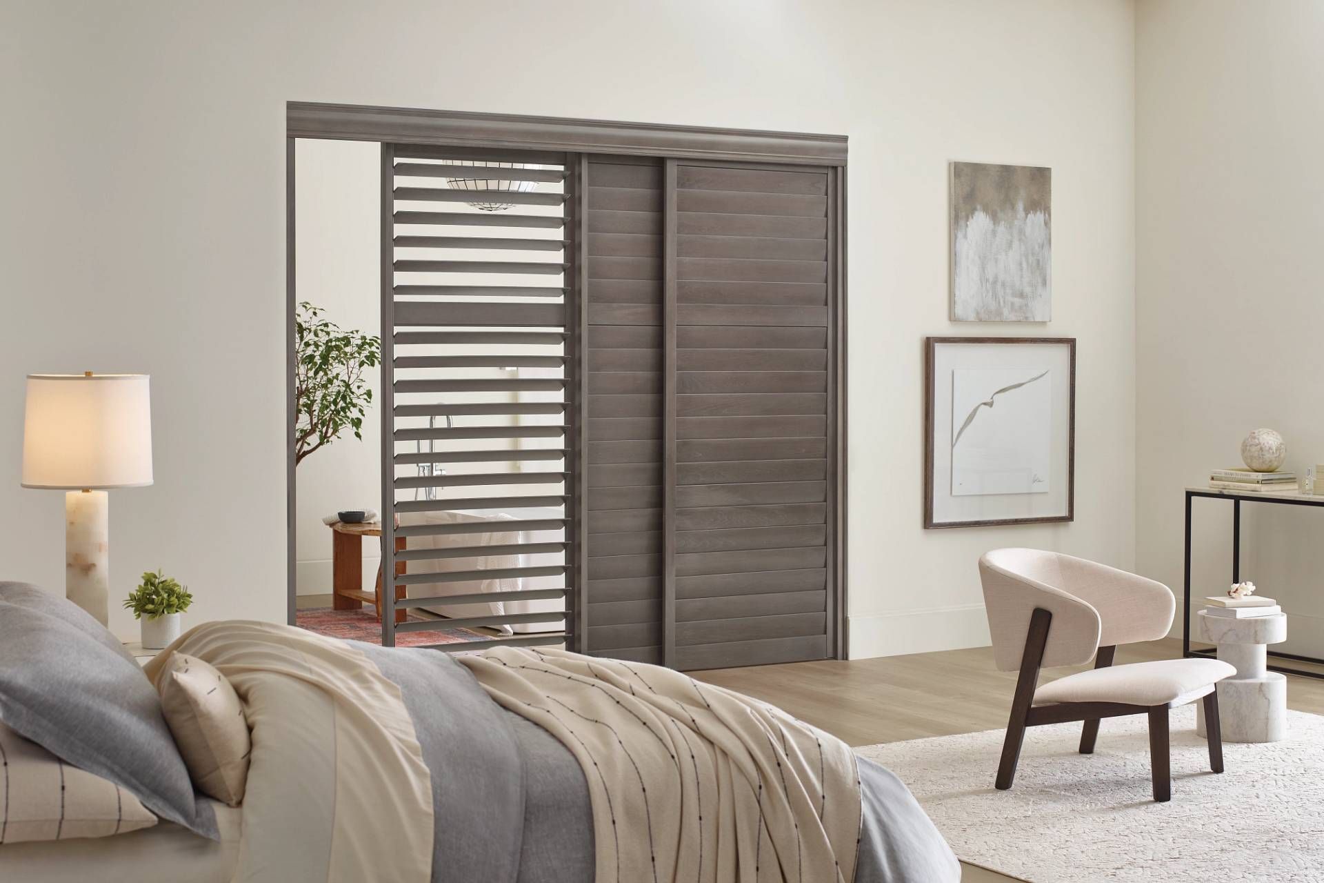 Bypass Hunter Douglas Heritance® Wood Shutters in a bedroom near Wichita, KS