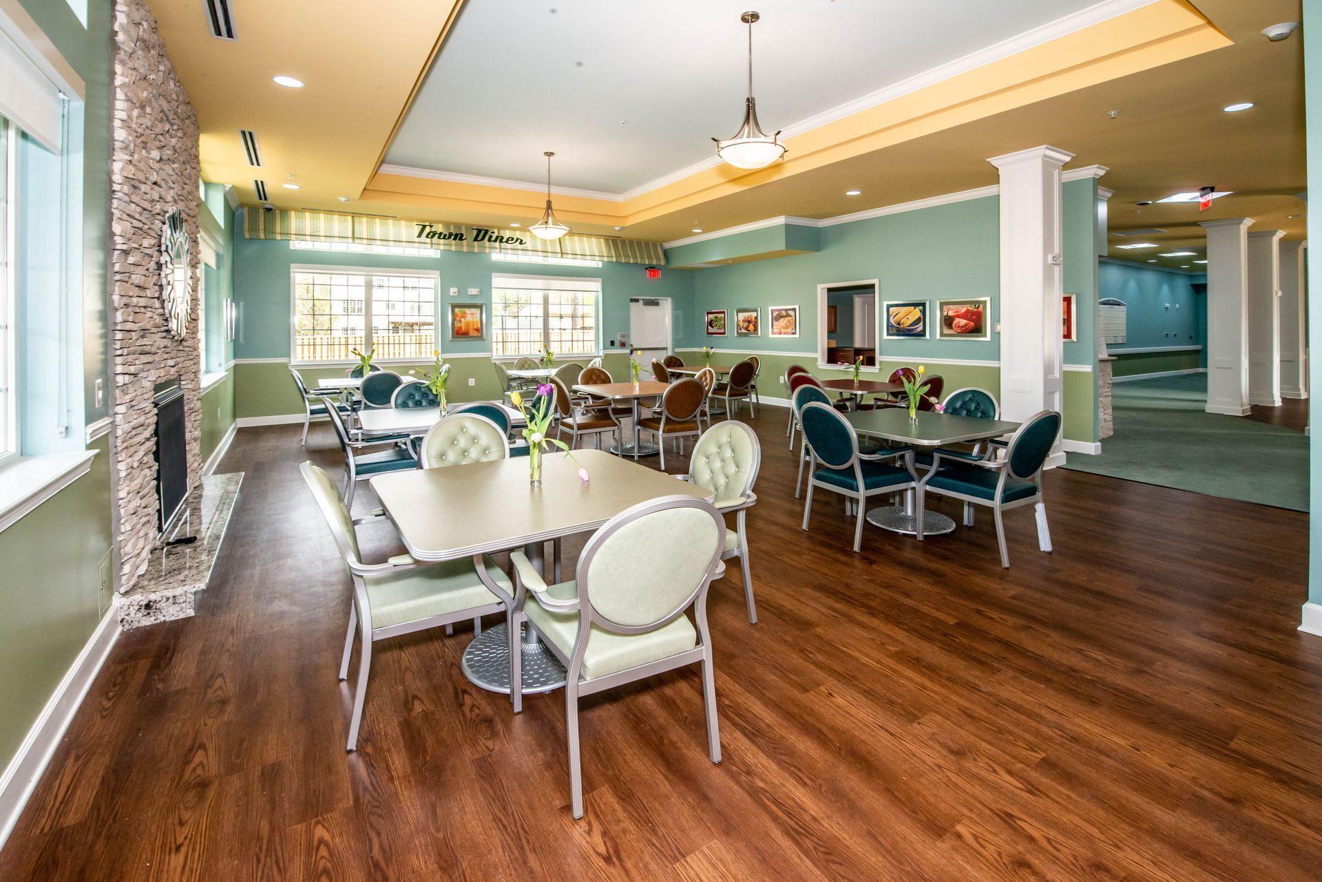 A large room with tables and chairs in it