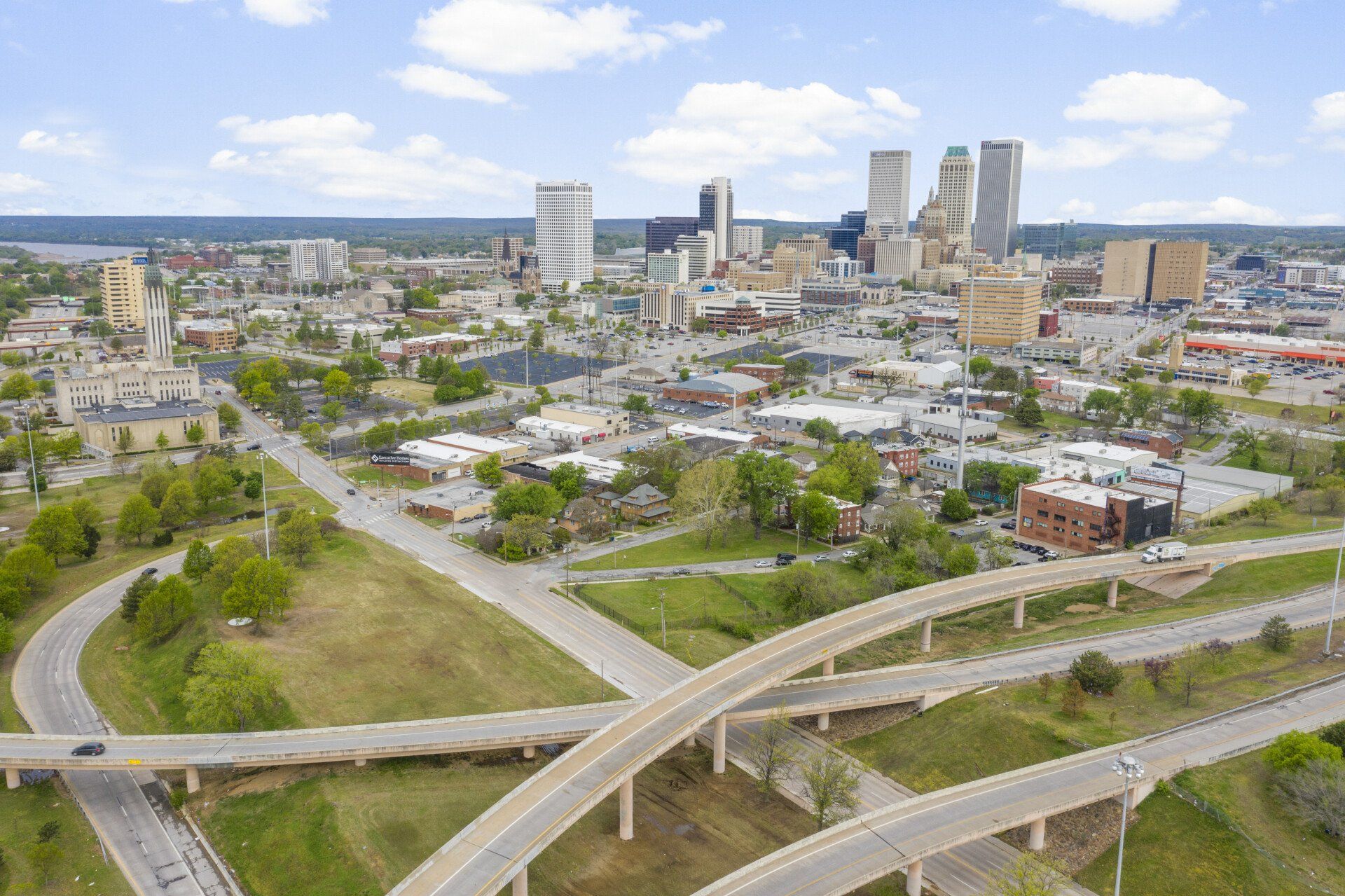 An aerial view of a city with a lot of roads and bridges.