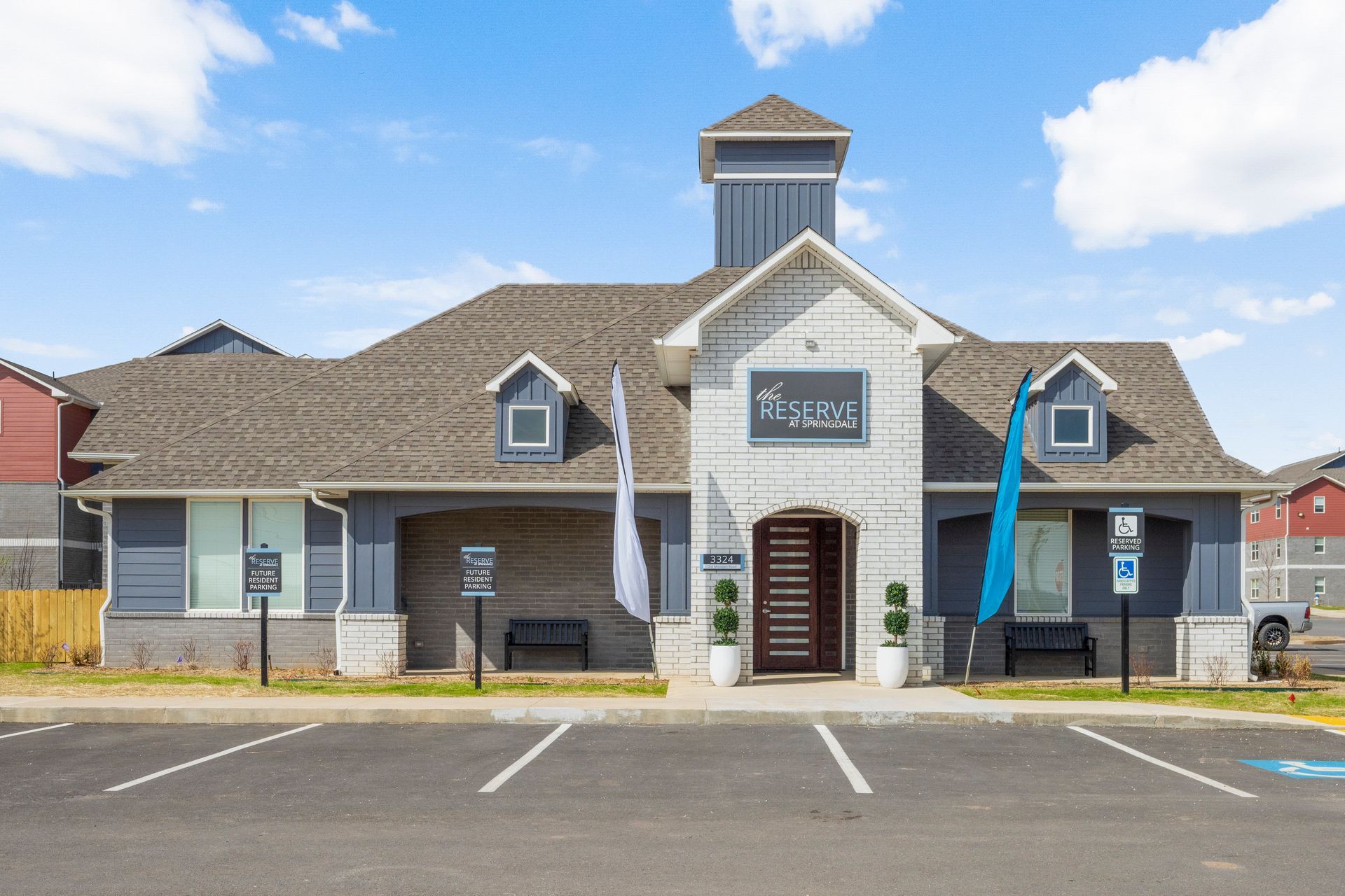 A large building with a parking lot in front of it