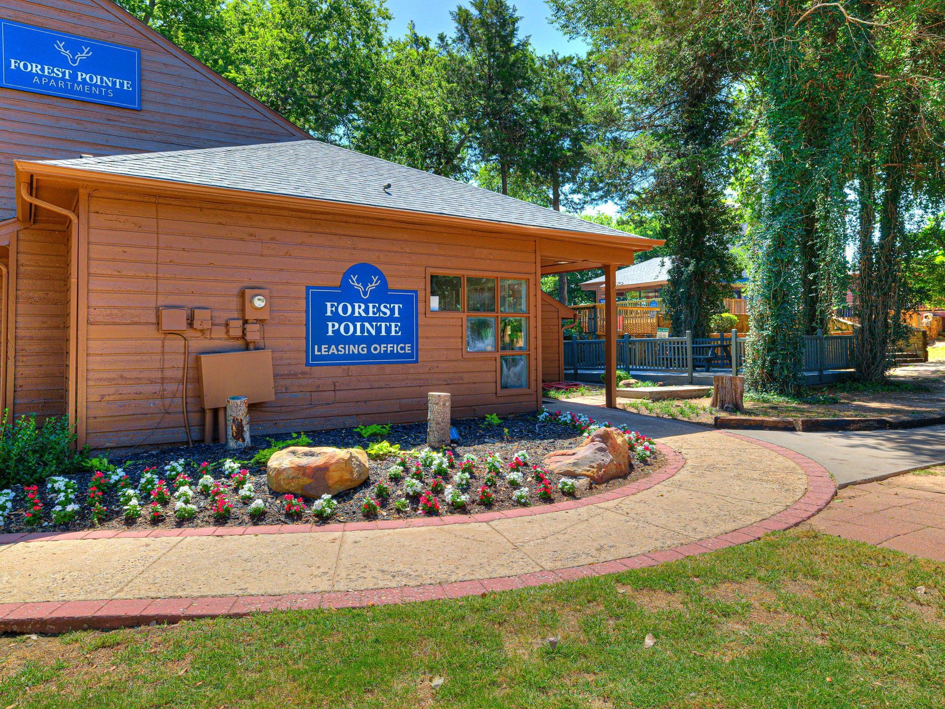A wooden building with a sign that says ' purest pointe ' on it