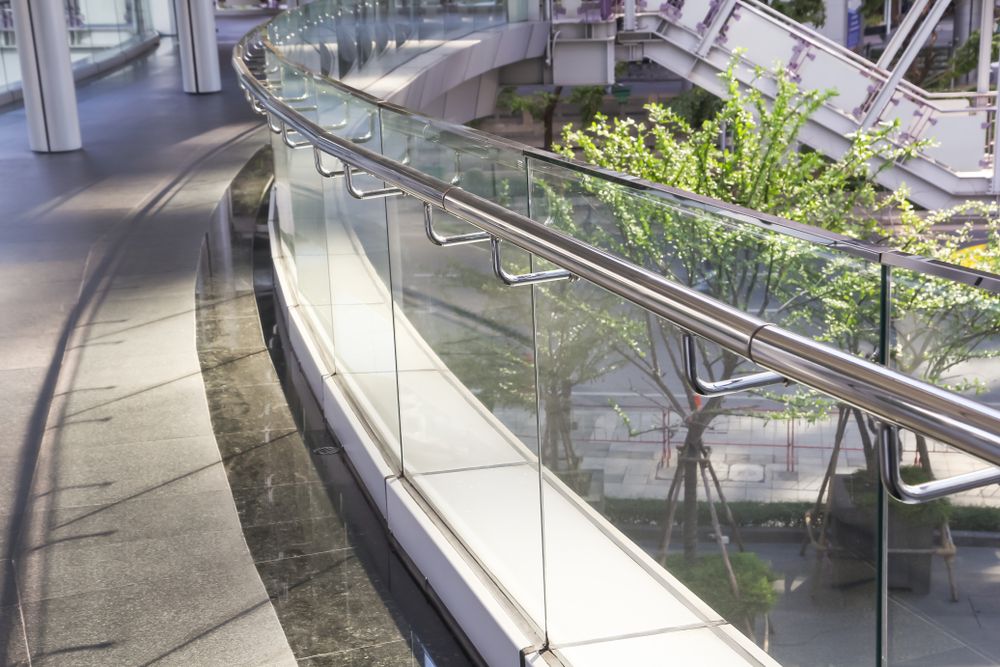 A Bridge With A Glass Railing And A Stainless Steel Railing — New England Glass & Aluminium In Moree, NSW