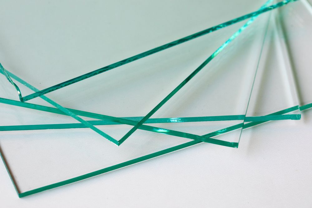 Three Pieces Of Clear Glass Are Stacked On Top Of Each Other — New England Glass & Aluminium In Guyra, NSW