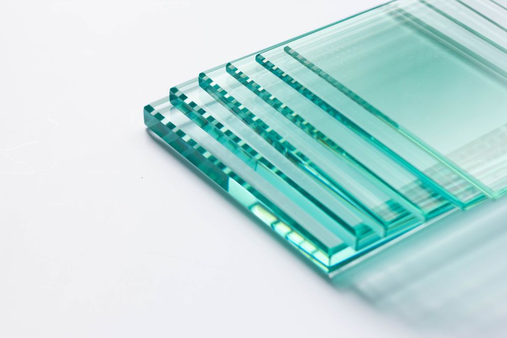 A Stack Of Clear Glass Coasters On A White Surface — New England Glass & Aluminium In Gunnedah, NSW