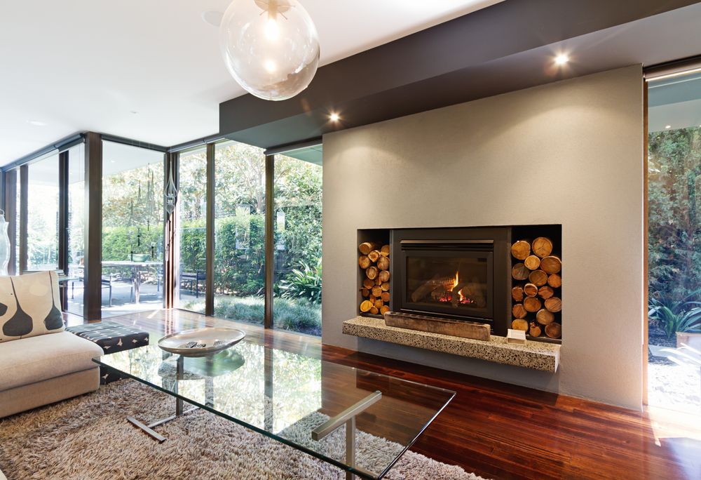 A Living Room With A Fireplace And A Glass Coffee Table — New England Glass & Aluminium In Armidale, NSW