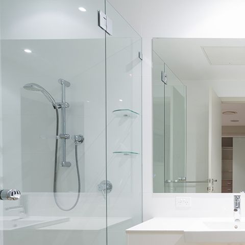 A Bathroom With A Glass Shower Door And A Sink — New England Glass & Aluminium In Armidale, NSW
